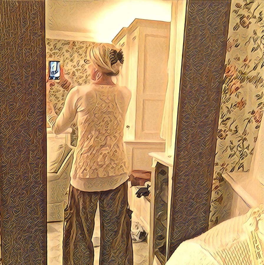 Me trying to take selfies as I pack for a trip.